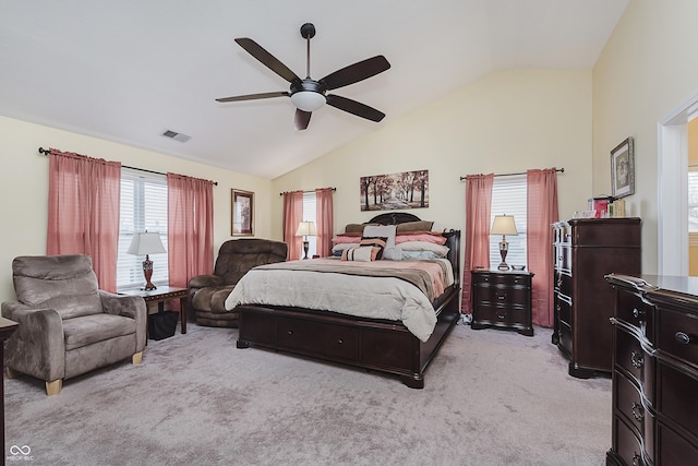 bedroom featuring ceiling fan, light carpet, and lofted ceiling