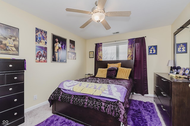 bedroom featuring ceiling fan and light colored carpet