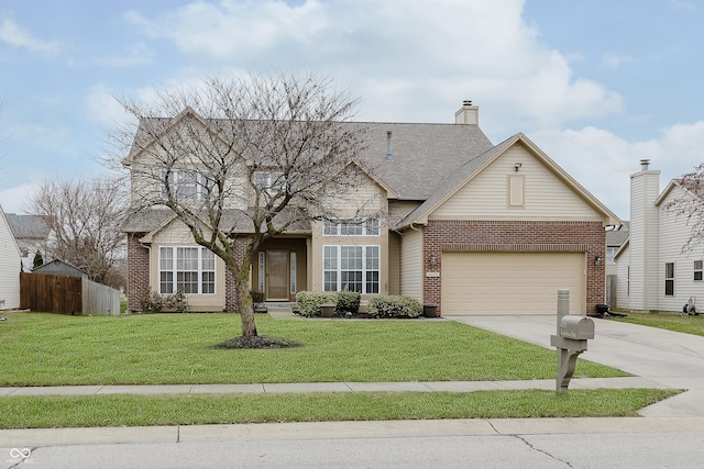 view of front of home featuring a garage and a front lawn