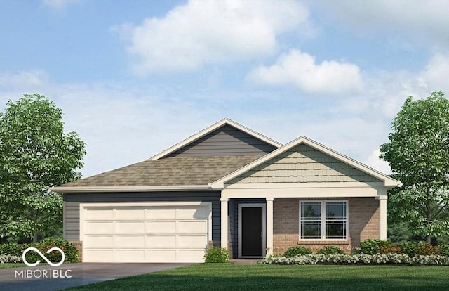 view of front of property with a front yard and a garage