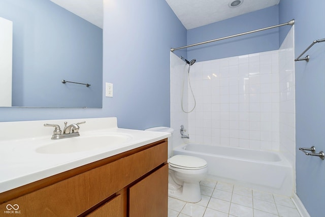 full bathroom featuring vanity, tile patterned flooring, a textured ceiling, toilet, and shower / bathing tub combination