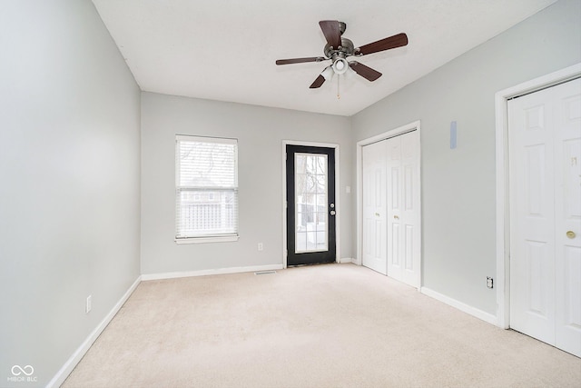 interior space featuring ceiling fan