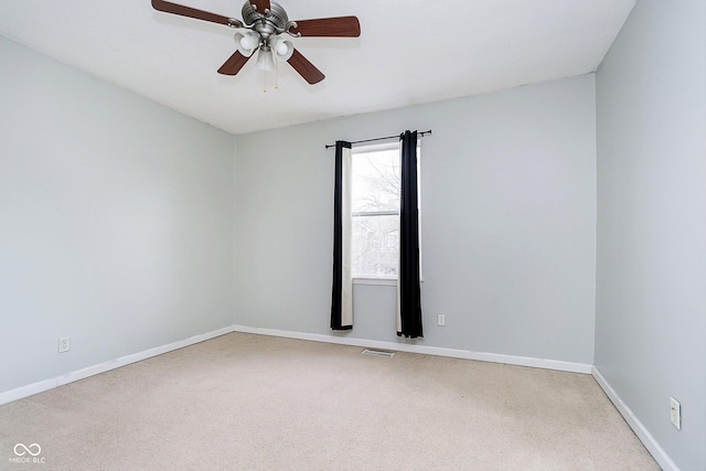 unfurnished room with ceiling fan and carpet floors