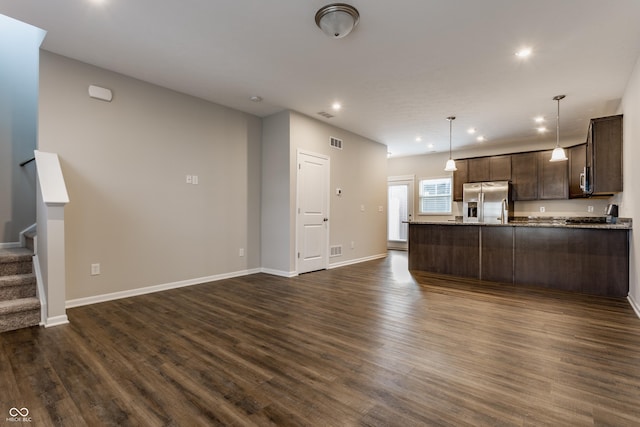 unfurnished living room with dark hardwood / wood-style floors