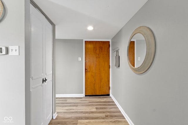 hallway with light wood-type flooring