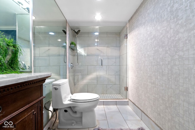 bathroom with vanity, toilet, tile walls, and an enclosed shower