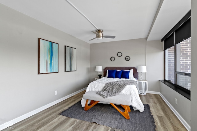 bedroom featuring hardwood / wood-style floors and ceiling fan