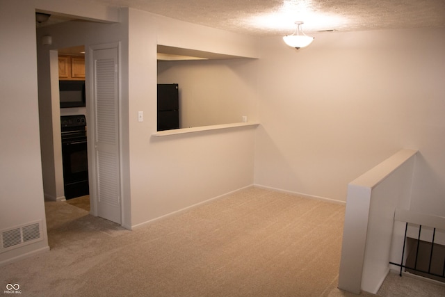 interior space with a textured ceiling