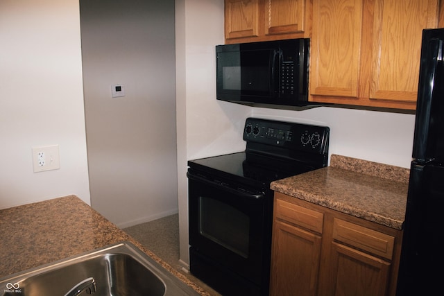 kitchen with black appliances and sink