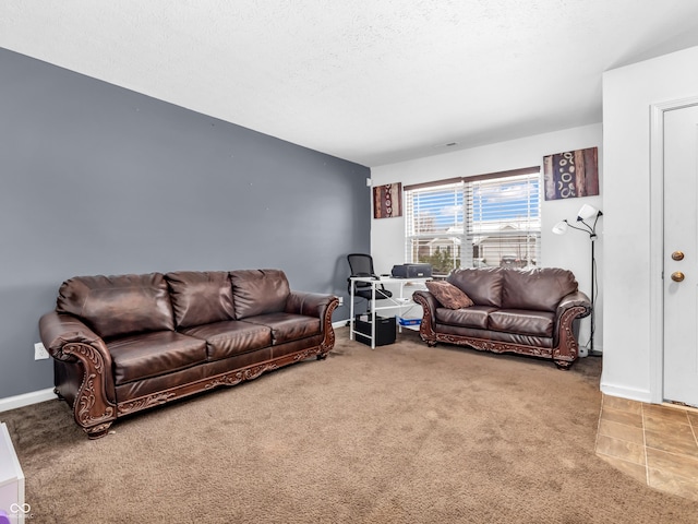 living room with carpet floors and a textured ceiling