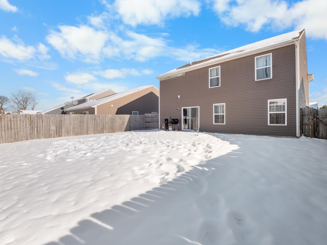 view of snow covered house