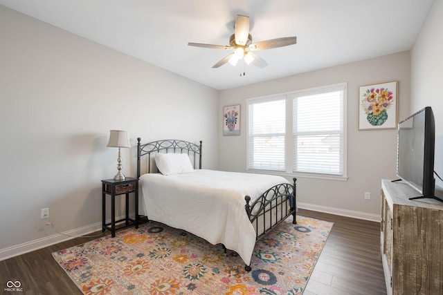 bedroom with dark wood-type flooring and ceiling fan