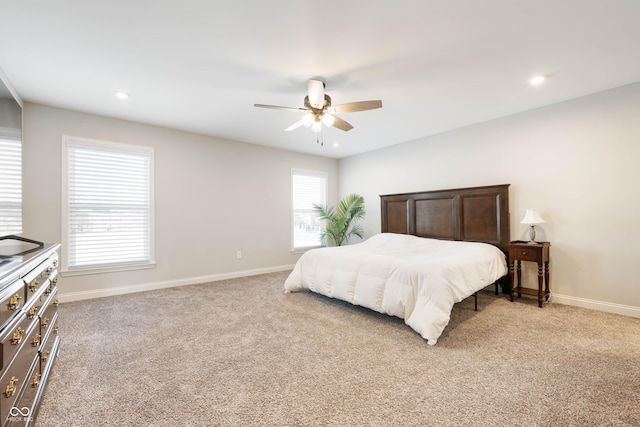 carpeted bedroom featuring ceiling fan