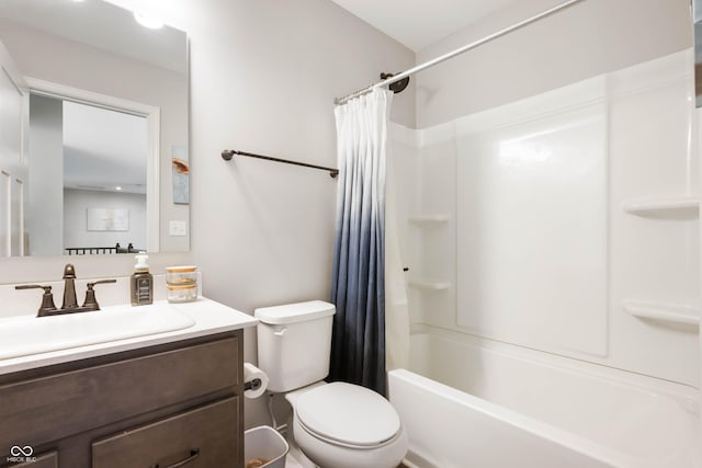 full bathroom featuring toilet, vanity, and shower / tub combo with curtain