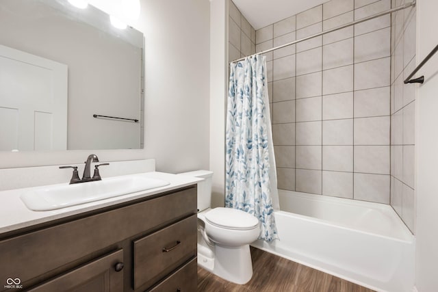 full bathroom featuring toilet, vanity, shower / tub combo with curtain, and hardwood / wood-style flooring