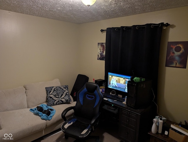 office area with a textured ceiling