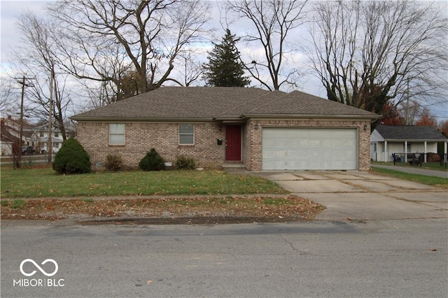 view of front of house featuring a garage and a front lawn