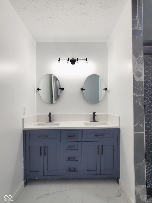 bathroom featuring vanity and a textured ceiling