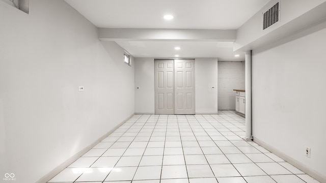 basement with light tile patterned floors