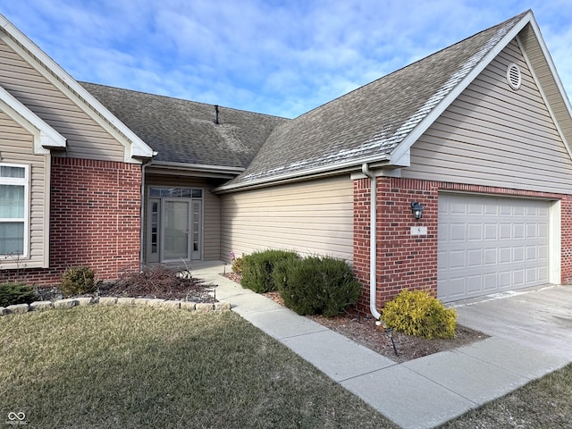 exterior space featuring a front lawn and a garage