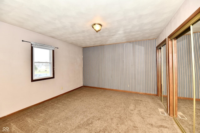 spare room with light colored carpet