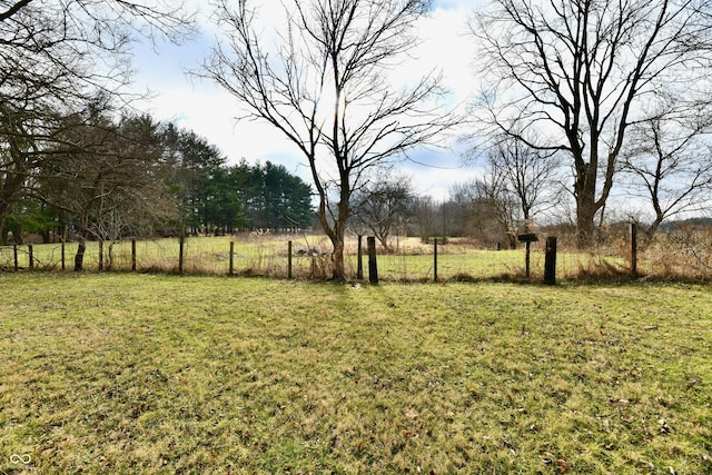 view of yard with a rural view