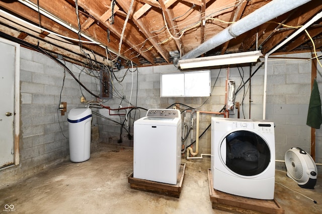 clothes washing area with separate washer and dryer