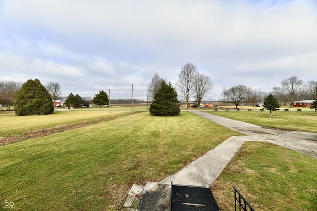 view of home's community with a lawn