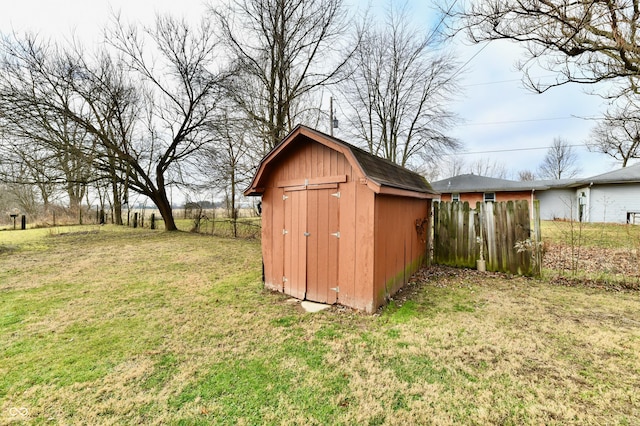 view of outbuilding with a yard