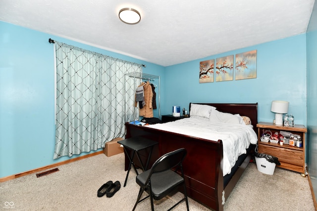 bedroom with light carpet