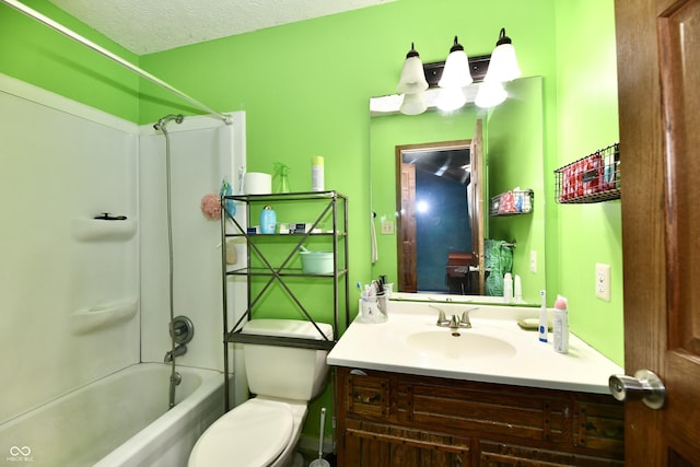 full bathroom with  shower combination, vanity, a textured ceiling, and toilet