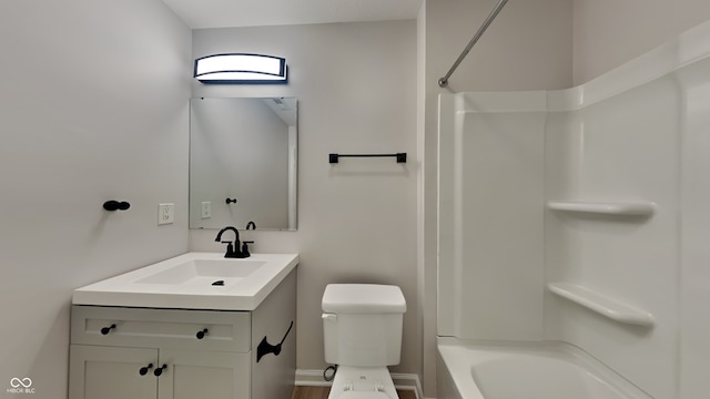 full bathroom featuring vanity, bathing tub / shower combination, and toilet