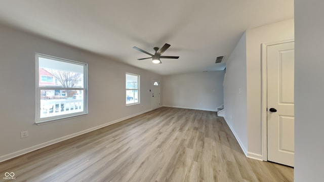 unfurnished room with ceiling fan and light wood-type flooring