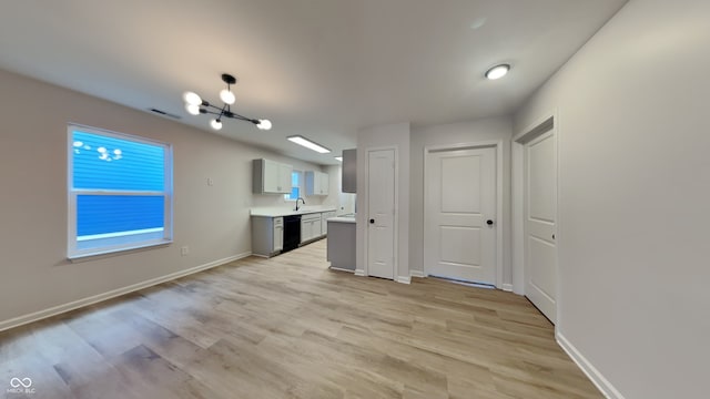 interior space with sink and light hardwood / wood-style flooring