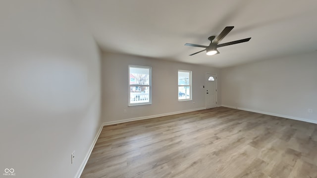 unfurnished room featuring light wood-type flooring and ceiling fan