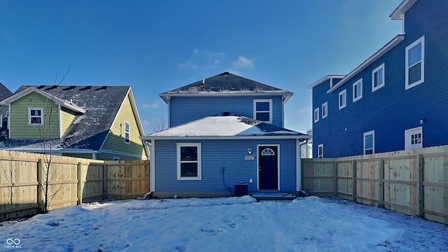 view of snow covered house