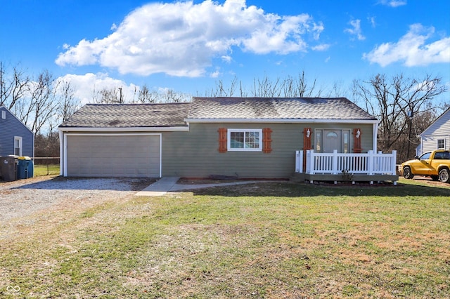 ranch-style home featuring a garage, a wooden deck, and a front yard