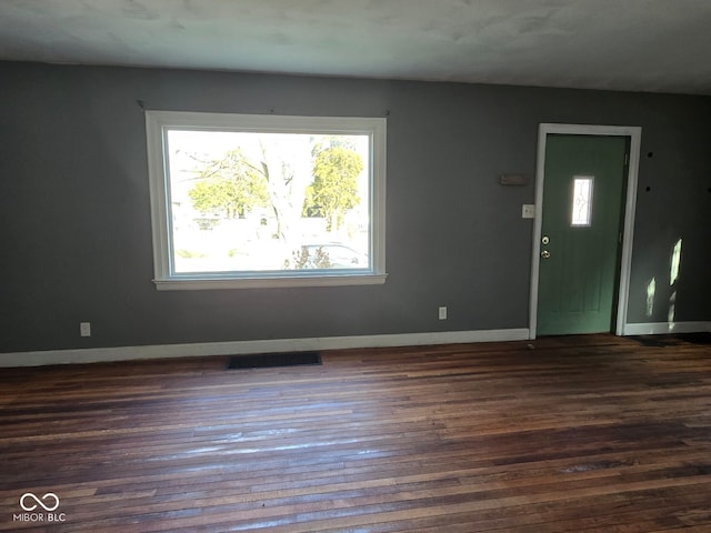 foyer with dark hardwood / wood-style flooring