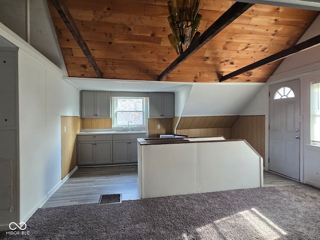 kitchen with gray cabinetry, light wood-type flooring, and wood ceiling