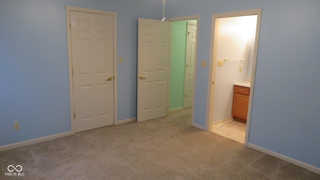 unfurnished bedroom featuring light carpet