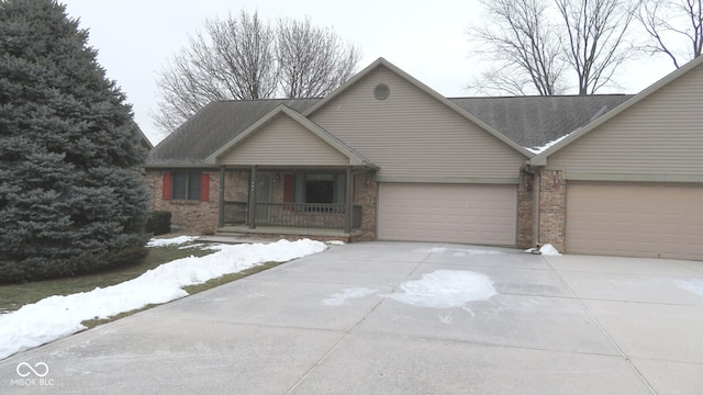 view of front of property featuring a garage and covered porch