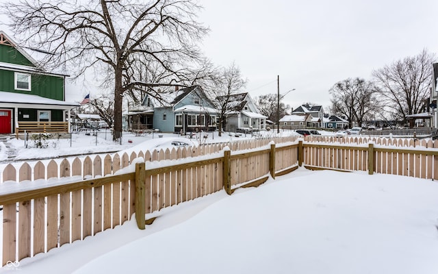 view of yard layered in snow