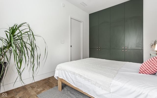 carpeted bedroom with a closet