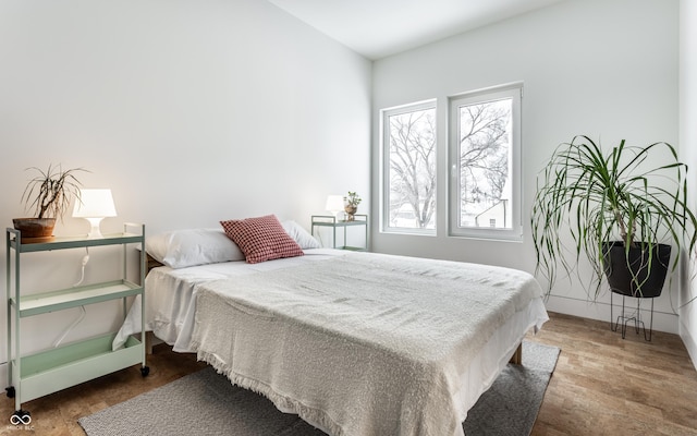 bedroom with wood-type flooring