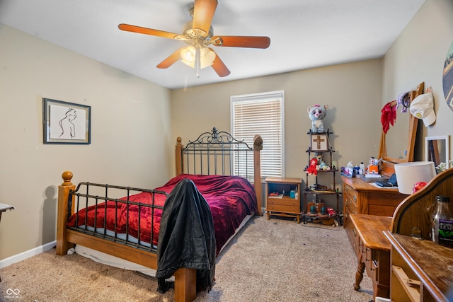 bedroom featuring light colored carpet and ceiling fan