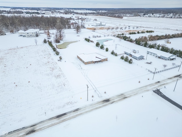 snowy aerial view featuring a rural view