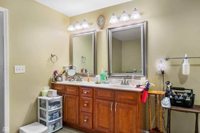 full bathroom featuring double vanity, tile patterned floors, and a sink