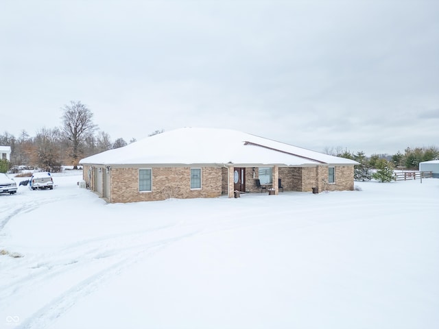 view of snow covered house