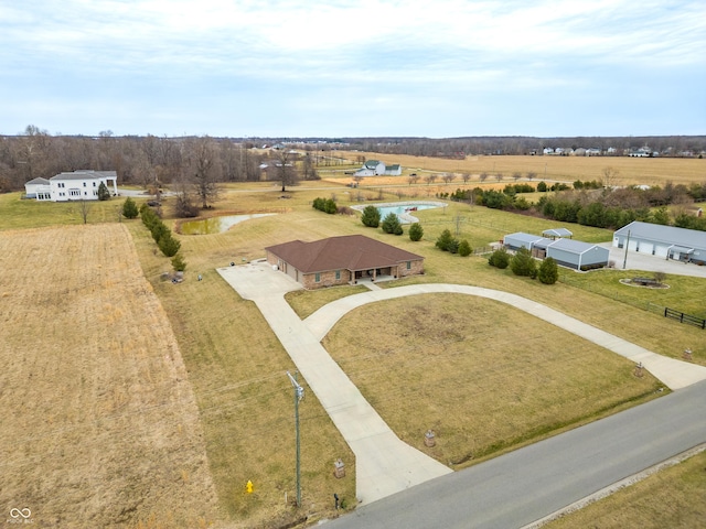 birds eye view of property with a rural view