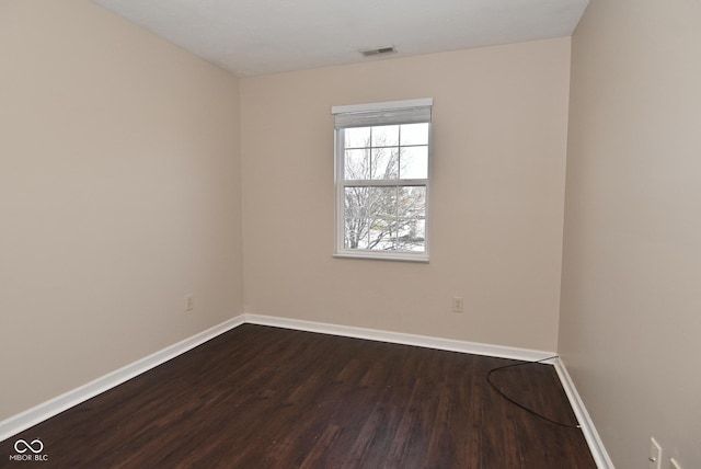 empty room featuring wood-type flooring